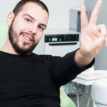 A happy patient at Cosmo Dental